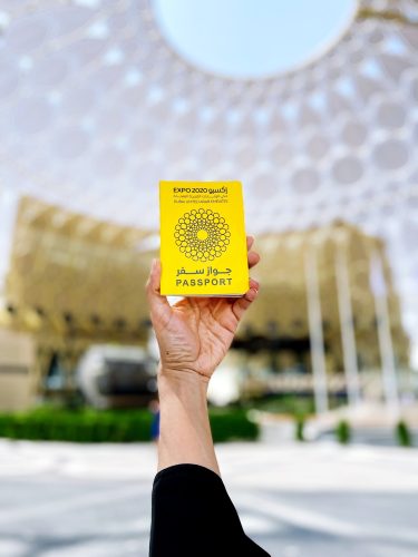 Hand holding Dubai expo 2020 passport